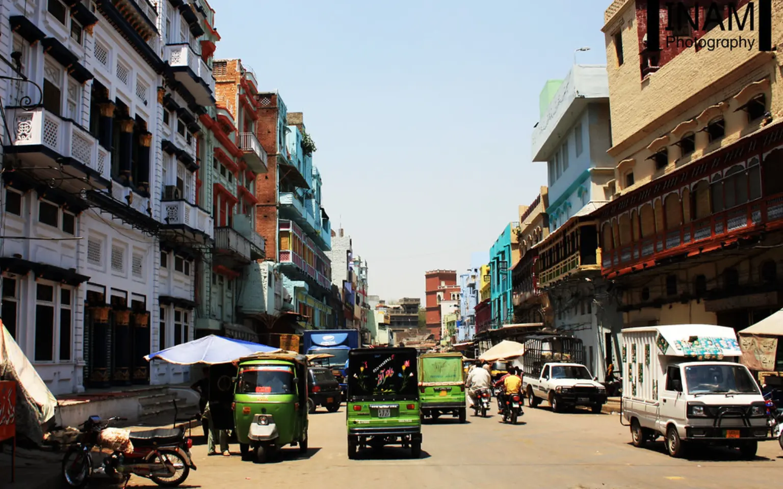 Balconied shopfronts along a street in Gawalmandi, Lahore