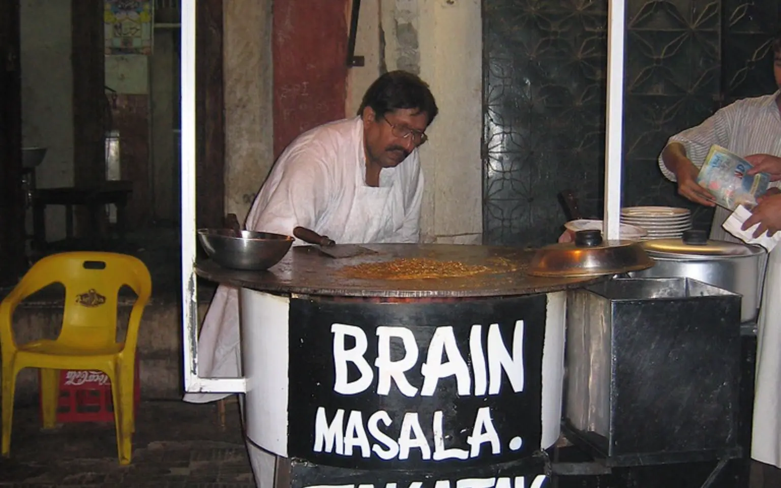 A Lahore street food stall cooking on the pavement