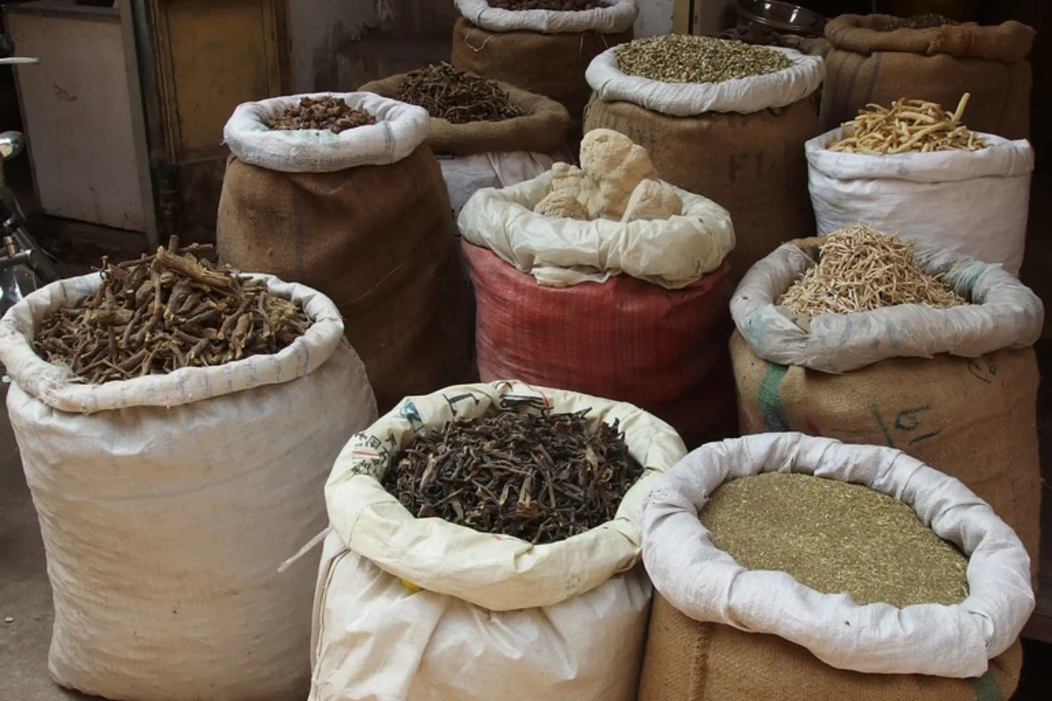 Open sacks of spices in a walled-city bazaar, Lahore