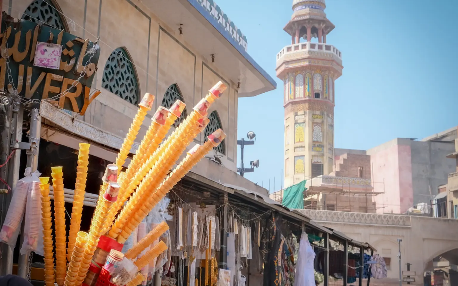 A shopfront hung with bright goods inside Lahore's walled city