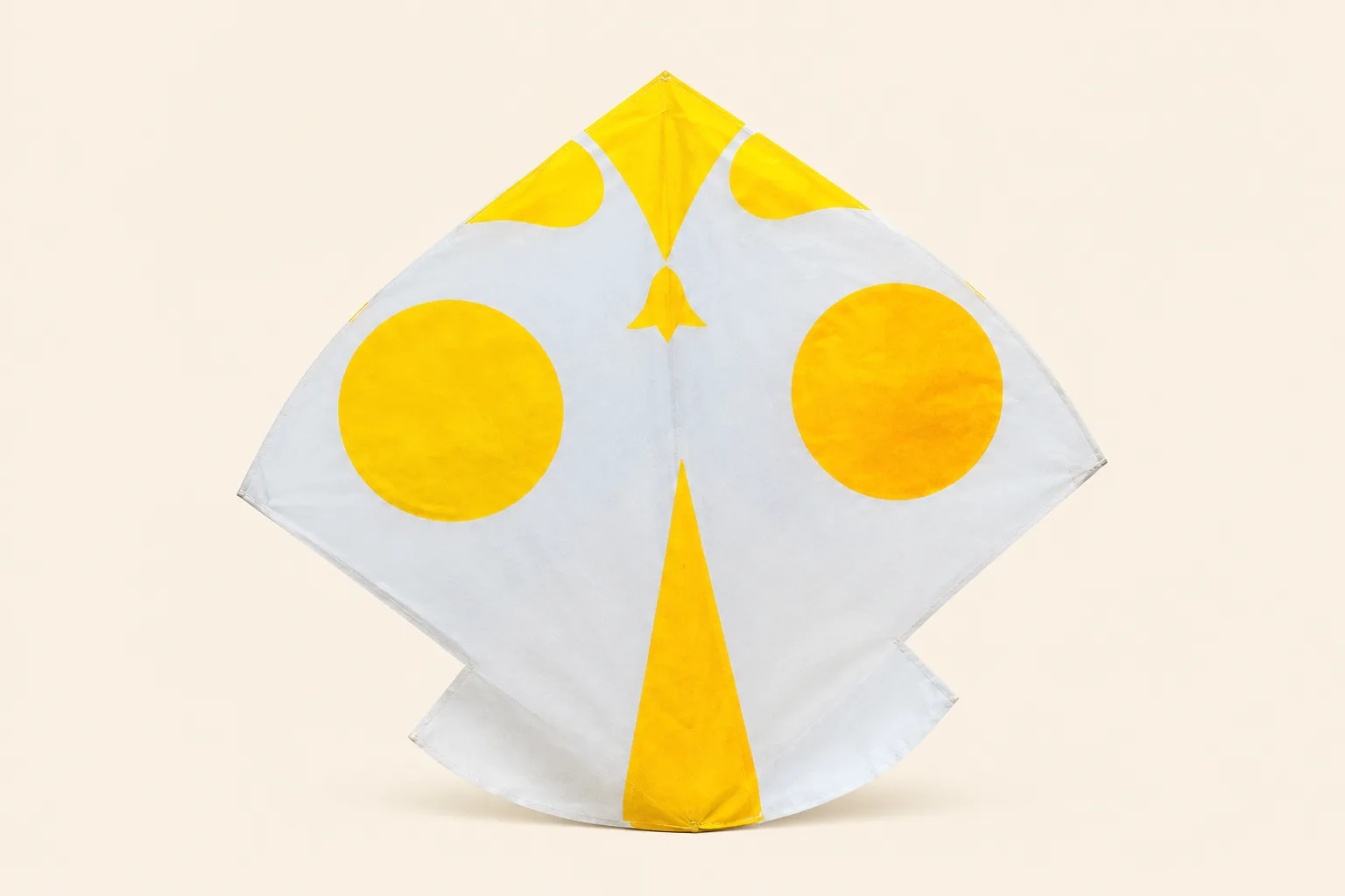 Fancy 1.5 tawa gudda — white paper printed with golden-yellow taj circles and bell motif
