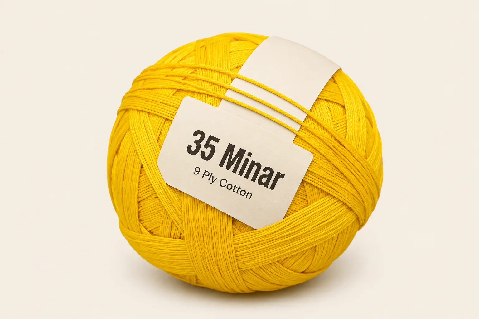 35 Minar pinna ball — golden yellow 9-ply cotton with a plain 35 Minar shop tag